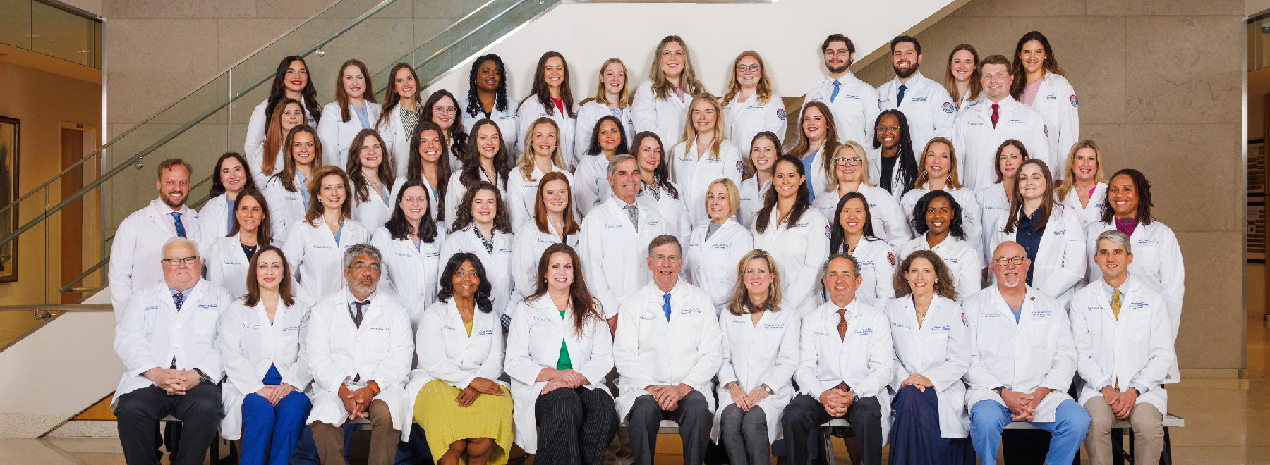 A group photo of the member of Department of Obstetrics and Gynecology poses for a group photo in the lobby of the School of Medicine